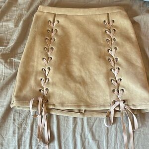 Mini skirt with suede like material and lace up details